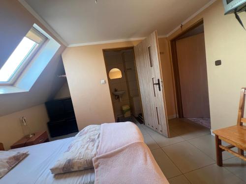 Postel nebo postele na pokoji v ubytování Gospodarstwo Agroturystyczne Bór