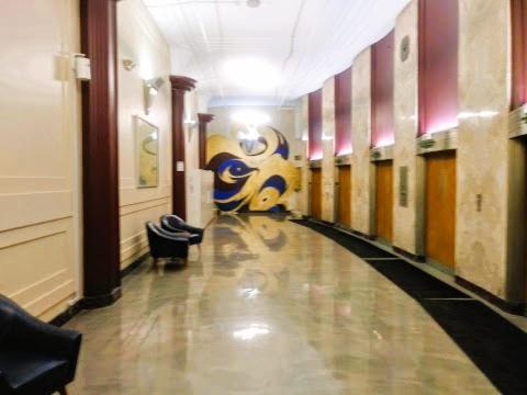 a hallway of a building with a painting on the wall at Downtown Indy Lucas Oil Conv Center Skywalk#5 in Indianapolis