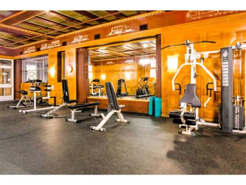a gym with several exercise equipment in a room at Downtown Indy Lucas Oil Conv Center Skywalk#5 in Indianapolis