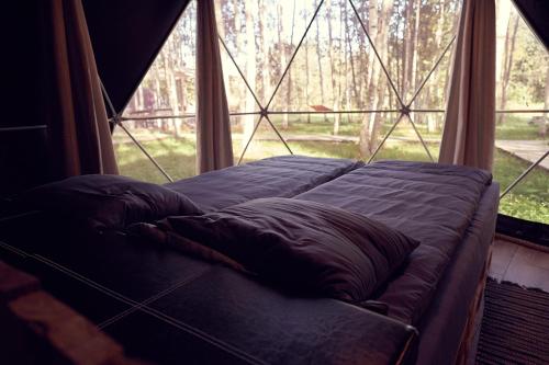 Cama o camas de una habitación en LES Glamping