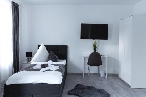 Ένα ή περισσότερα κρεβάτια σε δωμάτιο στο Lemsdorfer Apartments Magdeburg