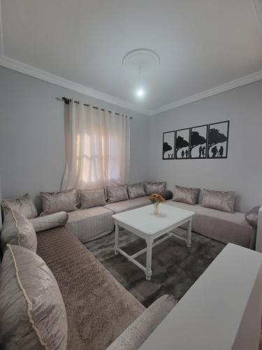 a living room with a couch and a table at Ourika Valley Haven - Breathe, Relax, Unwind in Ourika