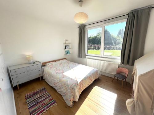 Postel nebo postele na pokoji v ubytování Maison spacieuse et lumineuse