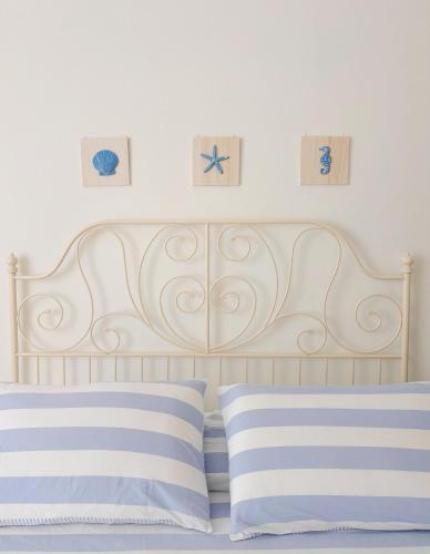 Letto o letti in una camera di A casa di Mario e Nenè
