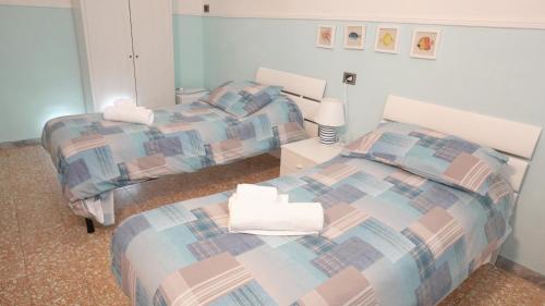 Letto o letti in una camera di A casa di Mario e Nenè