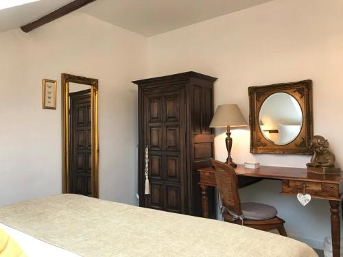 a bedroom with a bed and a desk and a mirror at Luxurious Townhouse 10 mins walk to Epernay centre in Épernay