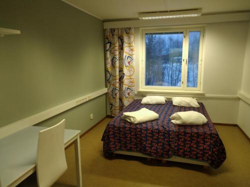 Postel nebo postele na pokoji v ubytování Grand Hostel Ivalo