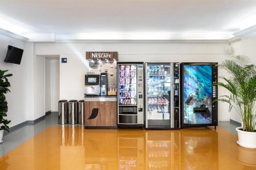a store with two vending machines in a room at Hotel Vibra Vila in Ibiza Town