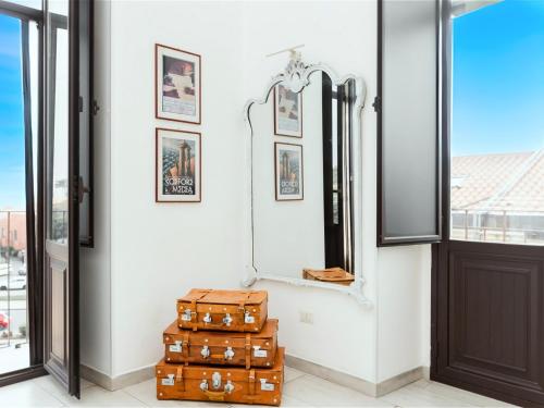 a room with luggage and a mirror and a door at Catania City Lodge - Free Parking - Next to Metro in Catania
