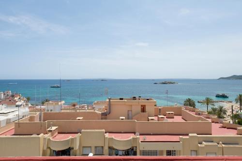 a view of the ocean from a building at Hotel Vibra Vila in Ibiza Town