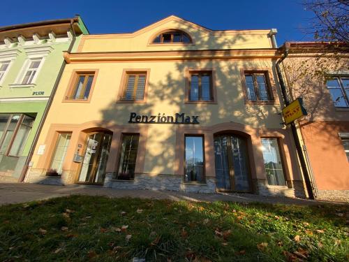 a building with the name raion tax on it at Penzión Max Kežmarok in Kežmarok