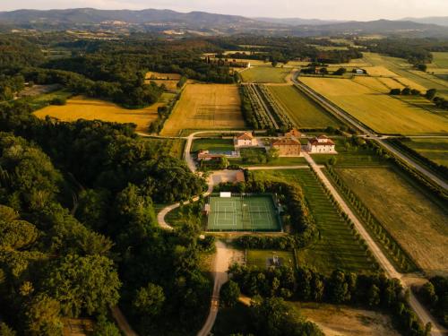 an aerial view of a tennis court in a field at Il Borro Relais & Châteaux in San Giustino Valdarno