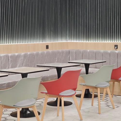 a group of tables and chairs in a room at Luxury City Baku Apart Hotel in Baku