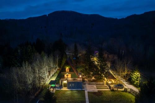 an aerial view of a house in the woods at night at CASA NATURA - charming chalet with hot tub in Tuk Vojni
