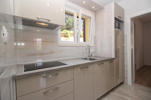 Kuchyň nebo kuchyňský kout v ubytování Sunshine Residence Baska