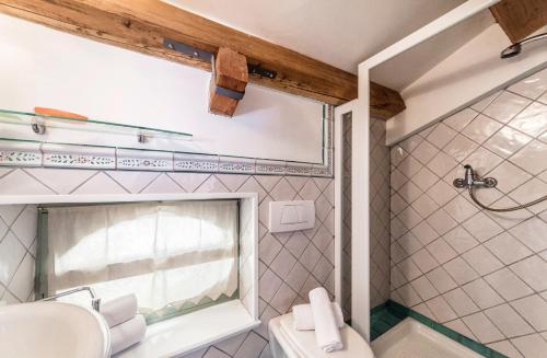 a bathroom with a sink and a shower at Villa De Rubeis Florit in Tarcento