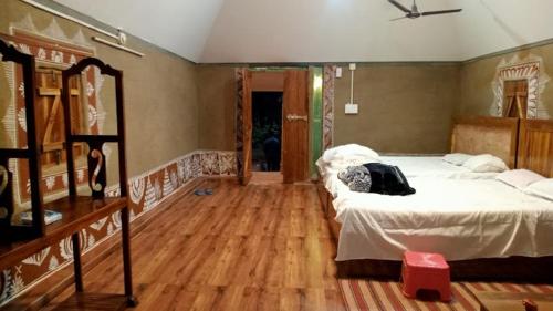 Postel nebo postele na pokoji v ubytování Mayurbhanj Eco Resort