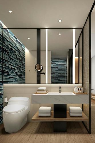 a bathroom with a toilet and a bath tub at Fairfield by Marriott Hangzhou Gongshu in Hangzhou