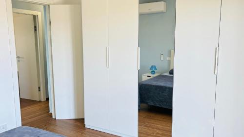 Postel nebo postele na pokoji v ubytování Villa sapore di mare con con spazio privato in spiaggia