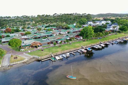 an aerial view of a town with boats in the water at River Apartment in Gated Complex in Keurboomstrand