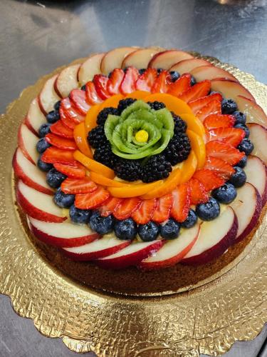 a patriotic cake with fruit on top of it at Agriturismo La.Ti.Mi.Da. in Cassine