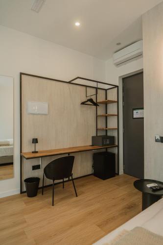 a room with a desk and a chair in it at Casa Cuatro Boutique Hotel - Adults Recommended in Novo Sancti Petri