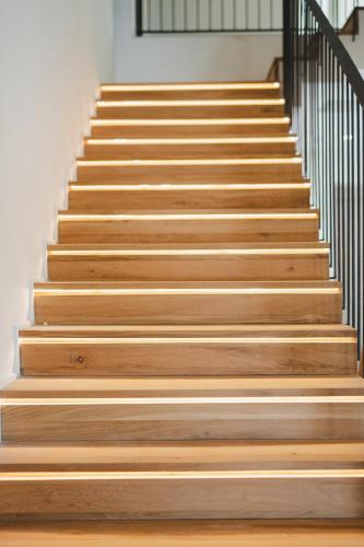 a set of wooden stairs in a building at Casa Cuatro Boutique Hotel - Adults Recommended in Novo Sancti Petri