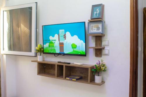 TV a/nebo společenská místnost v ubytování Happyhomes