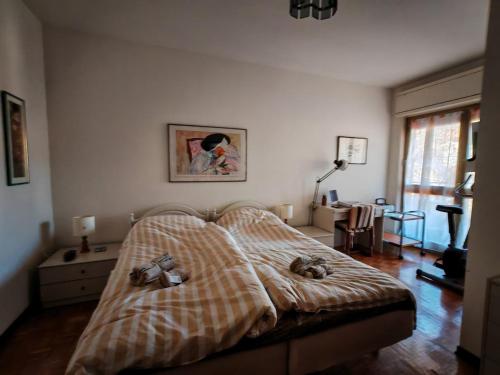 a bedroom with a bed with a blanket on it at Spacious family home in Ravascletto in Ravascletto