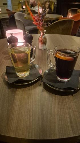 two cups of coffee sitting on a table at 2 bed apartment clan house apartments in Galway