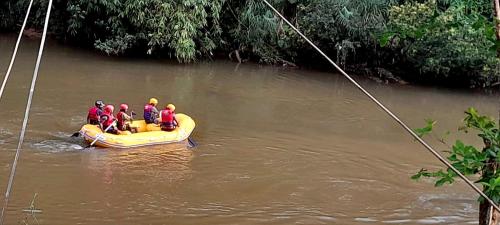 a group of people on a raft in a river at Sinharaja Vini Villa in Deniyaya
