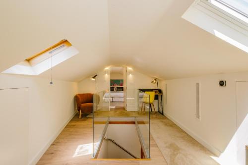 a room with a glass table and a bedroom at Bairro Alto Music Guest House in Lisbon