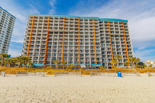 a large building on the beach next to the sand at Landmark 1134 in Myrtle Beach