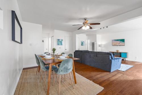 a living room with a table and a couch at Coastal Hideaway in San Diego