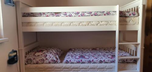a bedroom with two bunk beds in a room at AlVa- relax a oddych v Slovenskom raji in Dedinky
