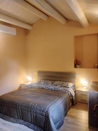 a bedroom with a bed and two night stands at Casa LEPRICE in SantʼElpidio a Mare
