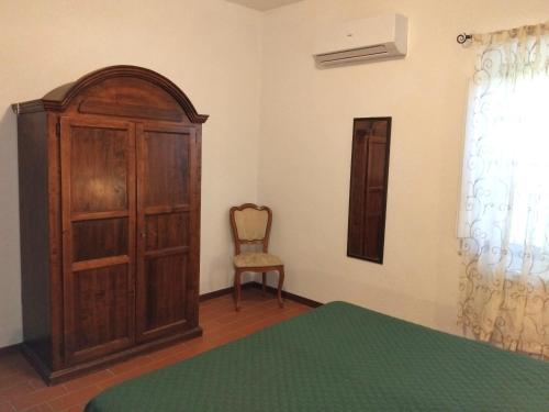 Postel nebo postele na pokoji v ubytování Agriturismo La Burraia vicino a San Gimignano-Air conditioning-EV wallbox
