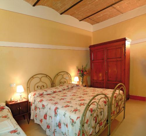 Ein Bett oder Betten in einem Zimmer der Unterkunft Poderi Arcangelo