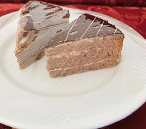 a piece of chocolate cake on a white plate at Mount Side Hiriketiya in Hiriketiya