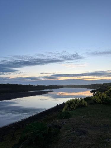 a view of a body of water at sunset at Domo cucao in Chonchi