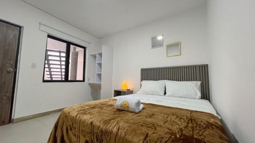 Postel nebo postele na pokoji v ubytování Hotel Fuente Real Popayán
