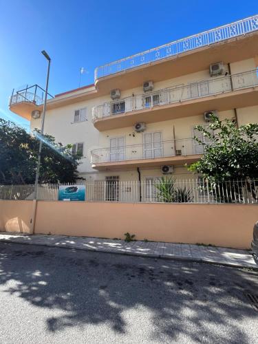 a building with balconies on the side of it at Confort Suites in Reggio Calabria