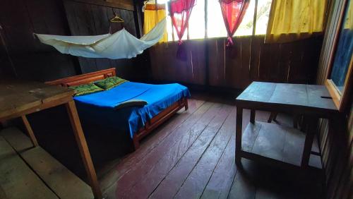 Cama o camas de una habitación en Hospedaje y tours Reina Arriera amazonas colombia