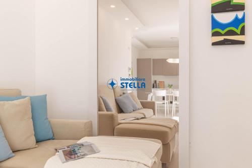 a living room with two chairs and a table at Cala Blu in Lido di Jesolo