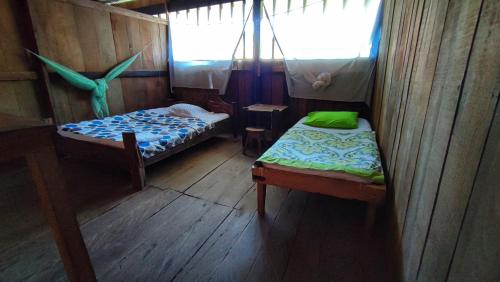 Cama o camas de una habitación en Hospedaje y tours Reina Arriera amazonas colombia