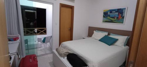 Katil atau katil-katil dalam bilik di Flat confortável e excelente para relaxar com a família