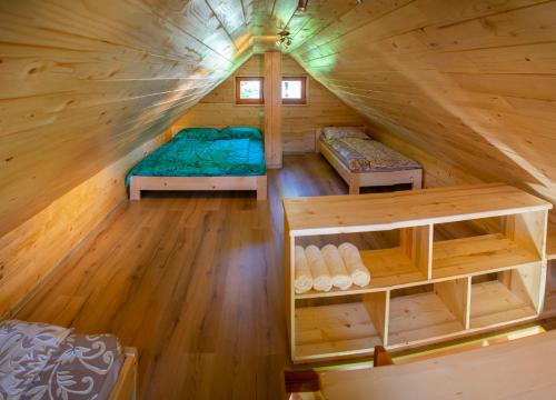 an overhead view of a bedroom in a log cabin at Wooden Chalet - Homestead Vrhovc in Železniki