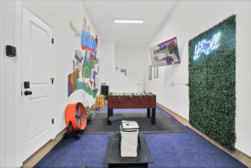 a hallway with a room with a table and a door at Victory Villa - Lux Townhome Walk 2 Globe Life - Rangers & Cowboys Stadiums in Arlington
