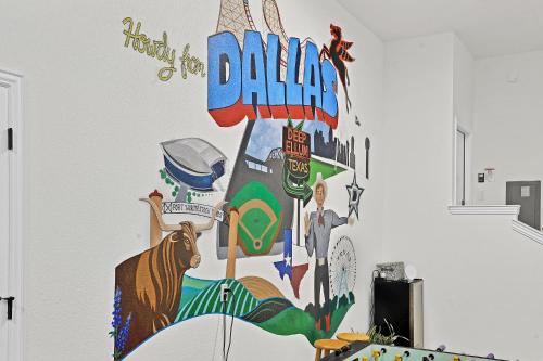 a wall with a mural of a dallas sign at Victory Villa - Lux Townhome Walk 2 Globe Life - Rangers & Cowboys Stadiums in Arlington