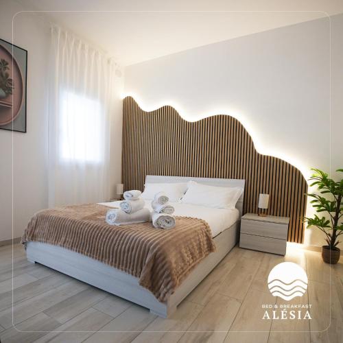Katil atau katil-katil dalam bilik di B&B Alèsia